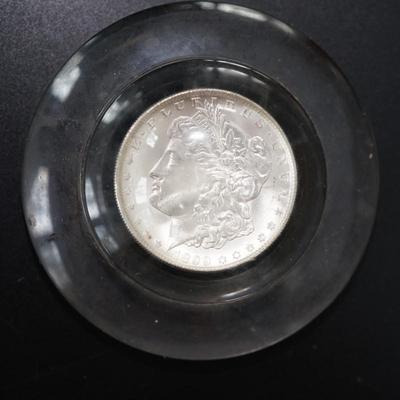 1899 MORGAN DOLLAR 0 IN PLEXIGLASS ENCLOSED