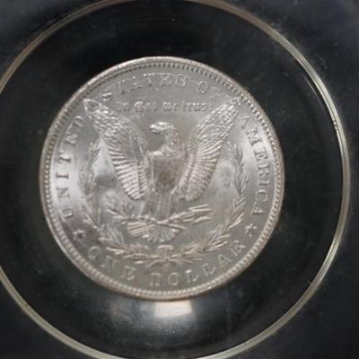 1899 MORGAN DOLLAR 0 IN PLEXIGLASS ENCLOSED