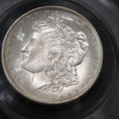 1899 MORGAN DOLLAR 0 IN PLEXIGLASS ENCLOSED