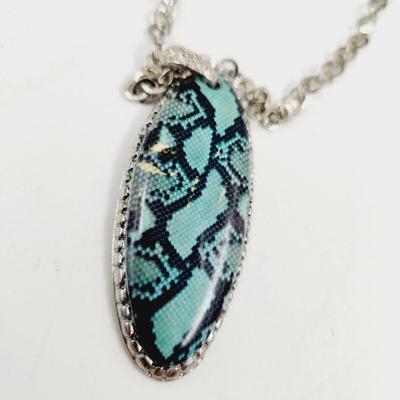 FUN SILVER TONED NECKLACE WITH BLUE/BLACK PENDANT