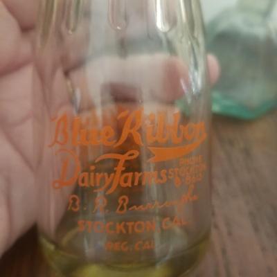 Vintage Stockton cream bottle and an antique ink wellwell