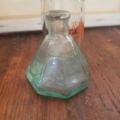 Vintage Stockton cream bottle and an antique ink wellwell