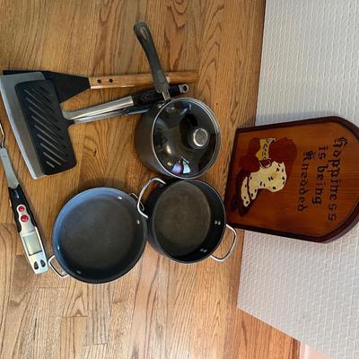 Lot of 8: Wooden Kneaded Sign, 2 Aluminum Cookwear pots, 1 Anodized non stick pot with lid, 3 various sized spatulas, 1 Meat thermometor