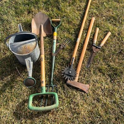 Assorted Garden Lot of 7: Watering Can, shovel, pitchfork, edger, 2 sheers, and an axe