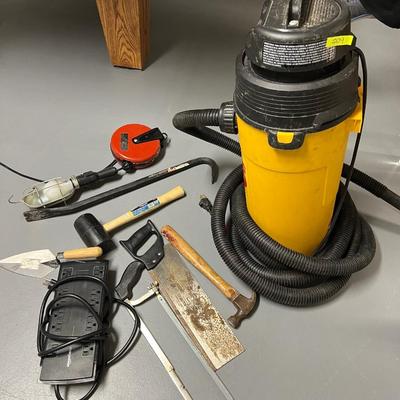 Lot of 9: Shopvac hang up pro wet dryvac; 1 hanging shop light; 1 Mallet; 1 crowbar; 1 hammer; 1 trowel; 2 saws; power strip