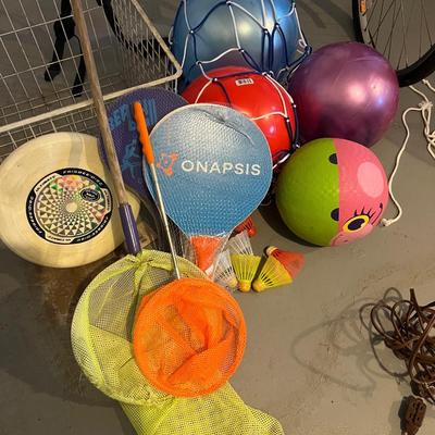Lot of 15: 2 paddle ball sets; 4 children's bouncy balls with carrying/storage net; 2 butterfly catchers; 6 birdies; 1 frisbee (and...