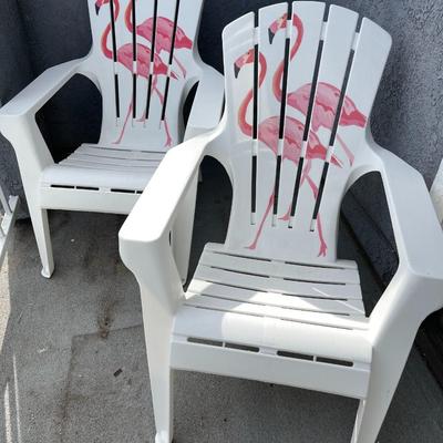 LOT 50  PAIR OF MOLDED PLASTIC DECK CHAIRS PAINTED PINK FLAMINGOS