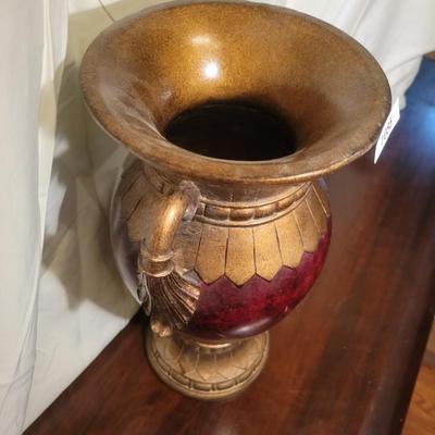 Red and brass colored vase