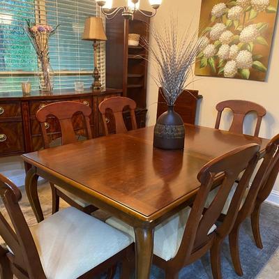 American Drew solid wood dining table with one leaf and six beige upholstered chairs