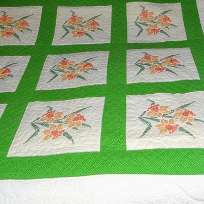 64" x 75" Orange Flowered Quilt With Green Border