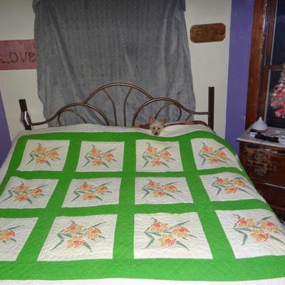 64" x 75" Orange Flowered Quilt With Green Border