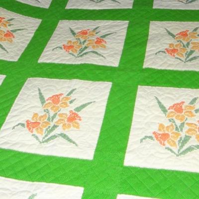64" x 75" Orange Flowered Quilt With Green Border
