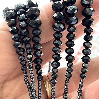 LOT 119  COSTUME JEWELRY TRIPLE STANDS OF OPERA LENGTH BEADS KNOTTED DROP