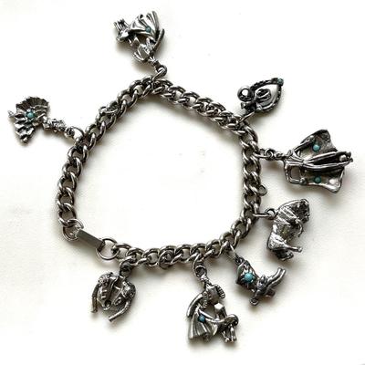 LOT 123  COSTUME JEWELRY SILVER TONE METAL CHARM BRACELET BULL FIGHTER THEME