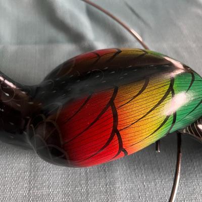 COLORFUL TOUCAN BIRD ON ROUND PERCH