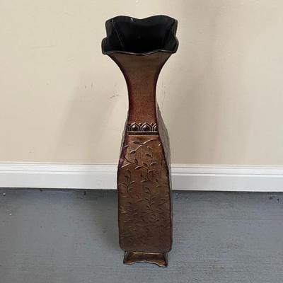 Tall metal vase