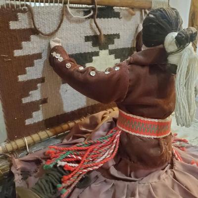 Native art of woman weaving carpet
