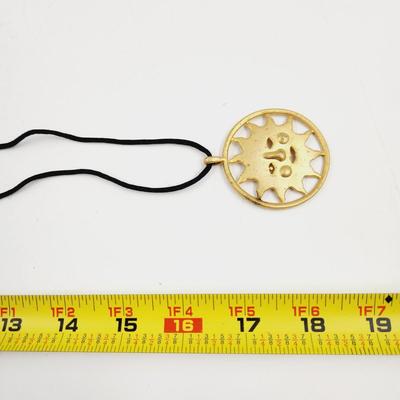 LARGE GOLD TONED SUN PENDANT W/ CLOTH NECKLACE