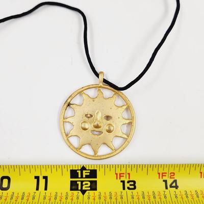 LARGE GOLD TONED SUN PENDANT W/ CLOTH NECKLACE