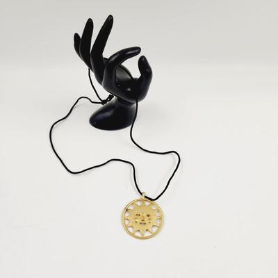 LARGE GOLD TONED SUN PENDANT W/ CLOTH NECKLACE