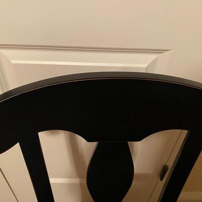 Black, slightly distressed wooden desk chair