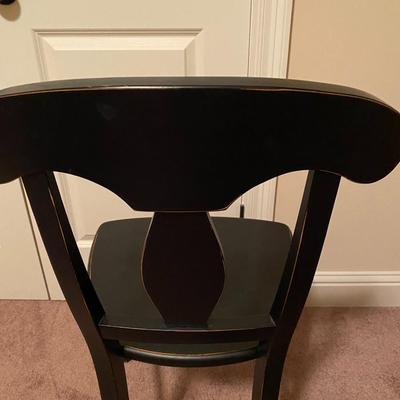Black, slightly distressed wooden desk chair