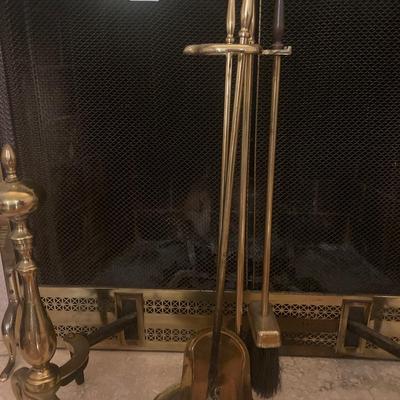Brass fireplace screen with matching andirons and fireplace tools