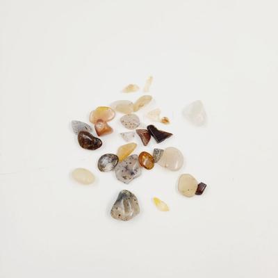 ARRAY OF TUMBLED STONE CHIPS INCLUDING QUARTZ CRYSTALS