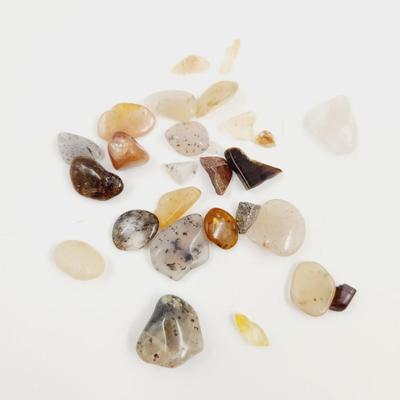 ARRAY OF TUMBLED STONE CHIPS INCLUDING QUARTZ CRYSTALS