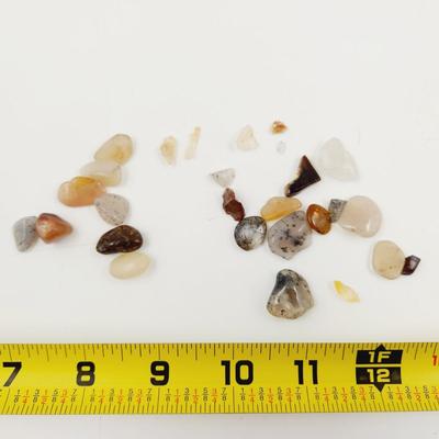 ARRAY OF TUMBLED STONE CHIPS INCLUDING QUARTZ CRYSTALS