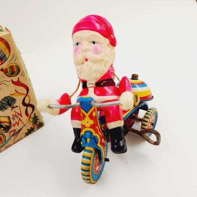 VINTAGE SANTA CELLULOID WIND UP ON TRICYCLE