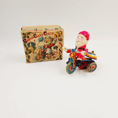 VINTAGE SANTA CELLULOID WIND UP ON TRICYCLE