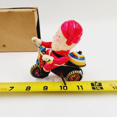 VINTAGE SANTA CELLULOID WIND UP ON TRICYCLE