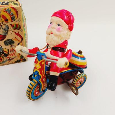 VINTAGE SANTA CELLULOID WIND UP ON TRICYCLE