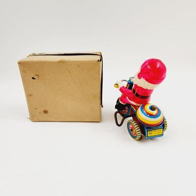 VINTAGE SANTA CELLULOID WIND UP ON TRICYCLE