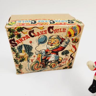 VINTAGE SANTA CELLULOID WIND UP ON TRICYCLE