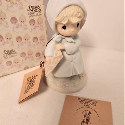 Lot #87  Precious Moments Figurine "March" - with box/tags