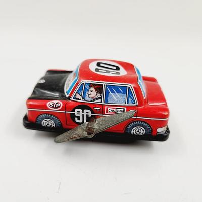 VINTAGE ALL THAT TIME TIN PLATE BENZ STP SPRING MADE TOY