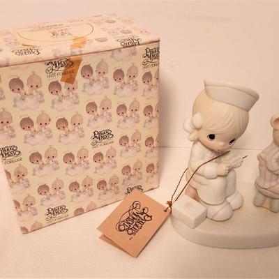 Lot #97  Precious Moments Figure "Love Cureth All Things" - has box/tags