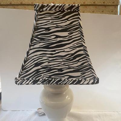 Beautiful white lamp with zebra print shade. 21” high. Like new.