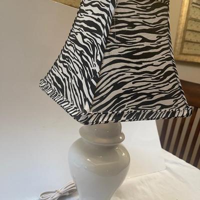 Beautiful white lamp with zebra print shade. 21” high. Like new.