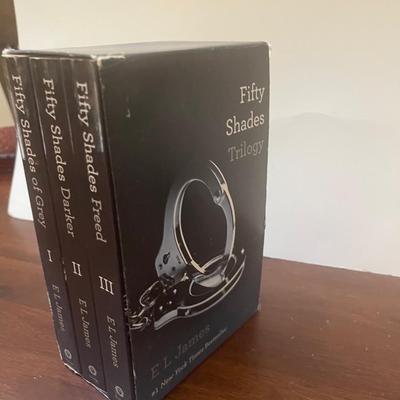 Fifty Shades of Grey trilogy book collection. Included book holder.