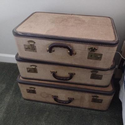 Set of Vintage Fabric Suitcases Being Sold as Home Accent Pieces