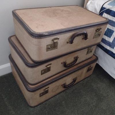 Set of Vintage Fabric Suitcases Being Sold as Home Accent Pieces