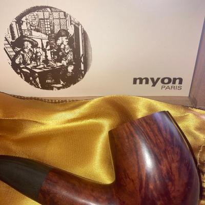 Lot of smoking pipes with two wooden pipe stands