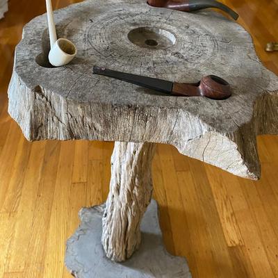 Lot of smoking pipes with two wooden pipe stands