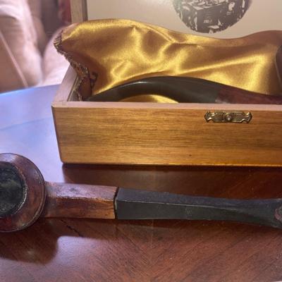 Lot of smoking pipes with two wooden pipe stands