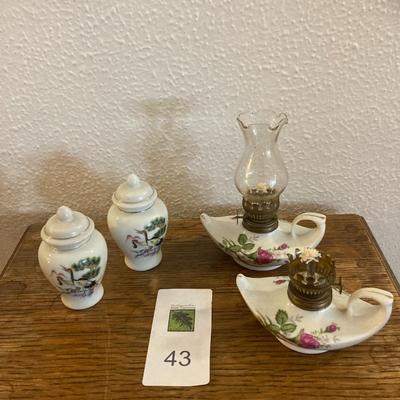 Pair of lidded jars and Genie in a bottle oil lamps