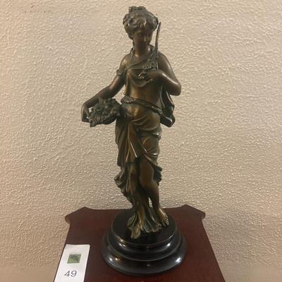 Patinated metal sculpture of a woman