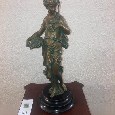 Patinated metal sculpture of a woman